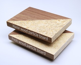 The photo shows two partially veneered pieces of particle board that look almost identical. Some of the wood chips on the upper board are slightly darker. 